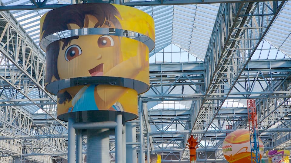 Nickelodeon Universe showing rides, interior views and a bay or harbor