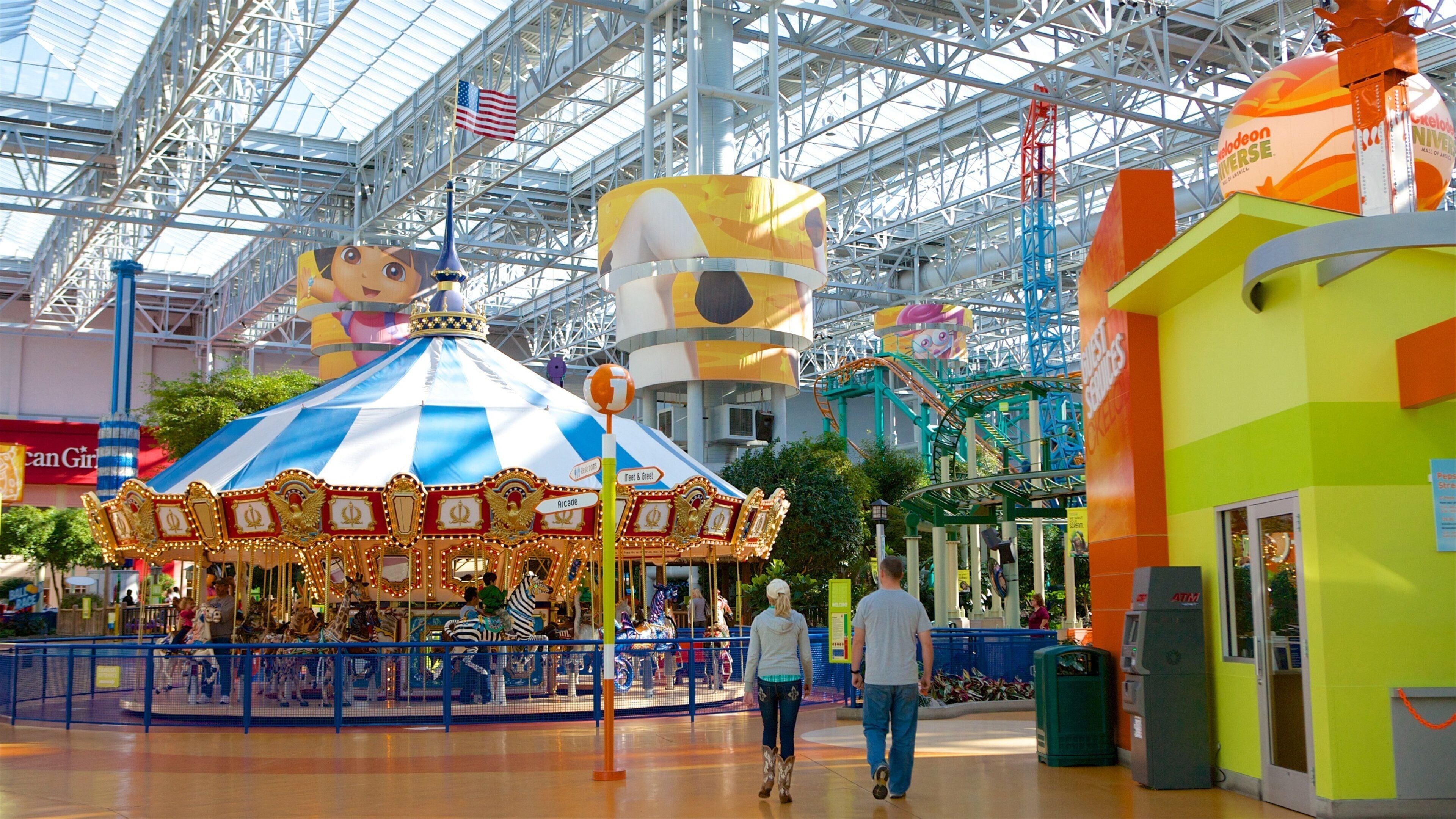 Nickelodeon Universe featuring rides as well as a couple