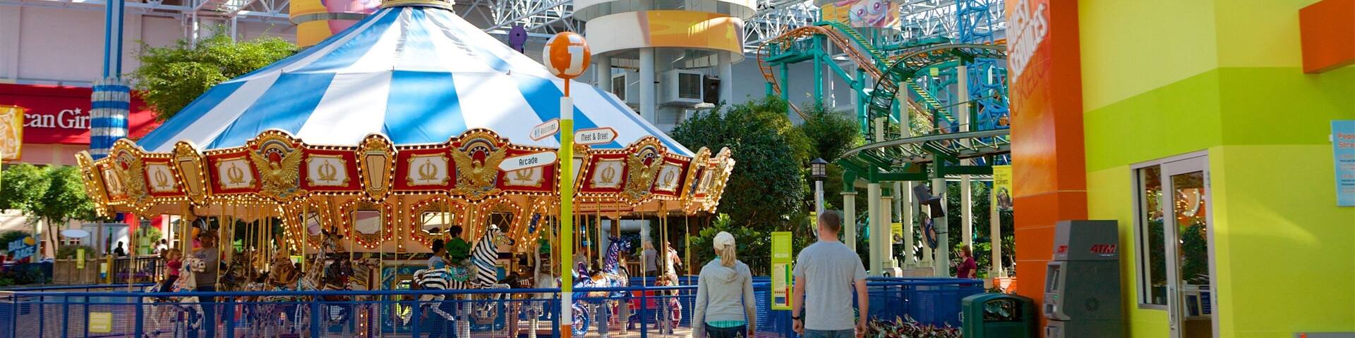 Nickelodeon Universe featuring rides as well as a couple