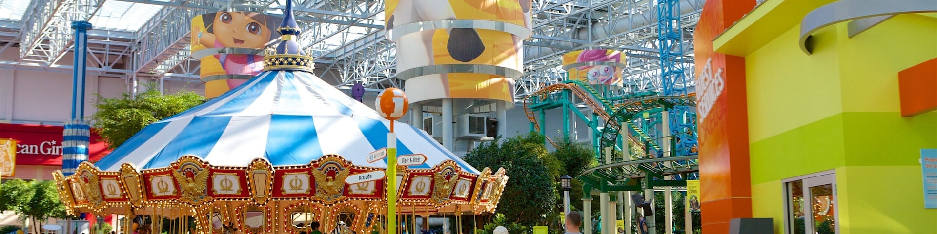 Nickelodeon Universe featuring rides as well as a couple