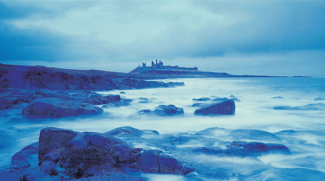 Gloomy coastline with distant castle