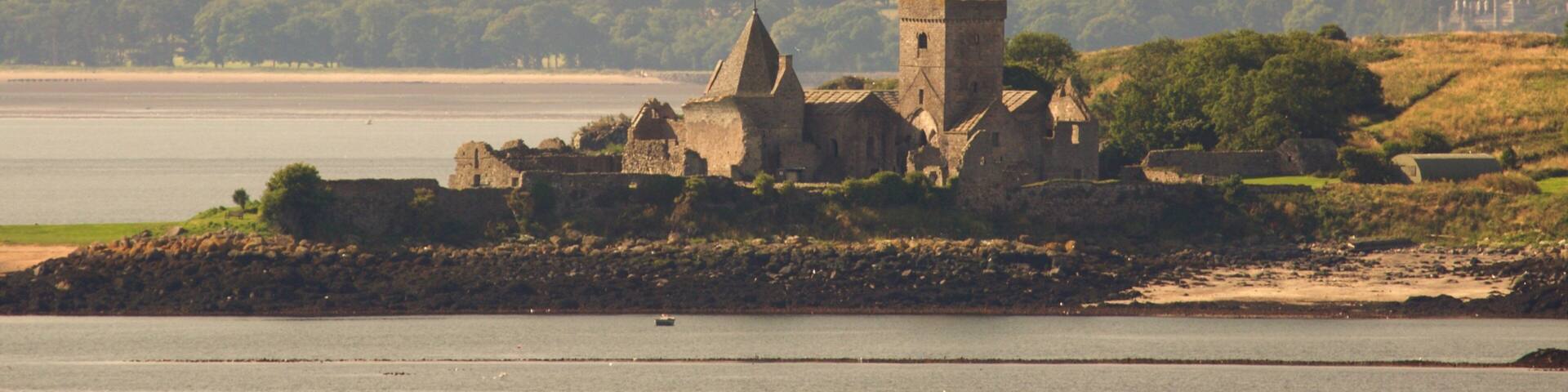 Inchcolm Abbey which includes general coastal views and a castle