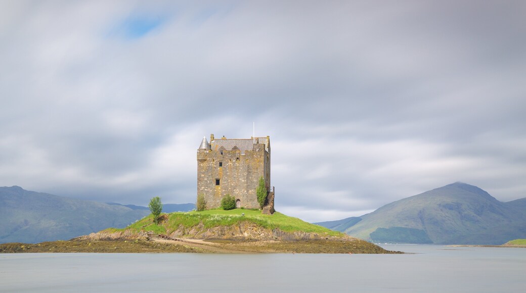 Castle Stalker showing heritage elements, a lake or waterhole and heritage architecture