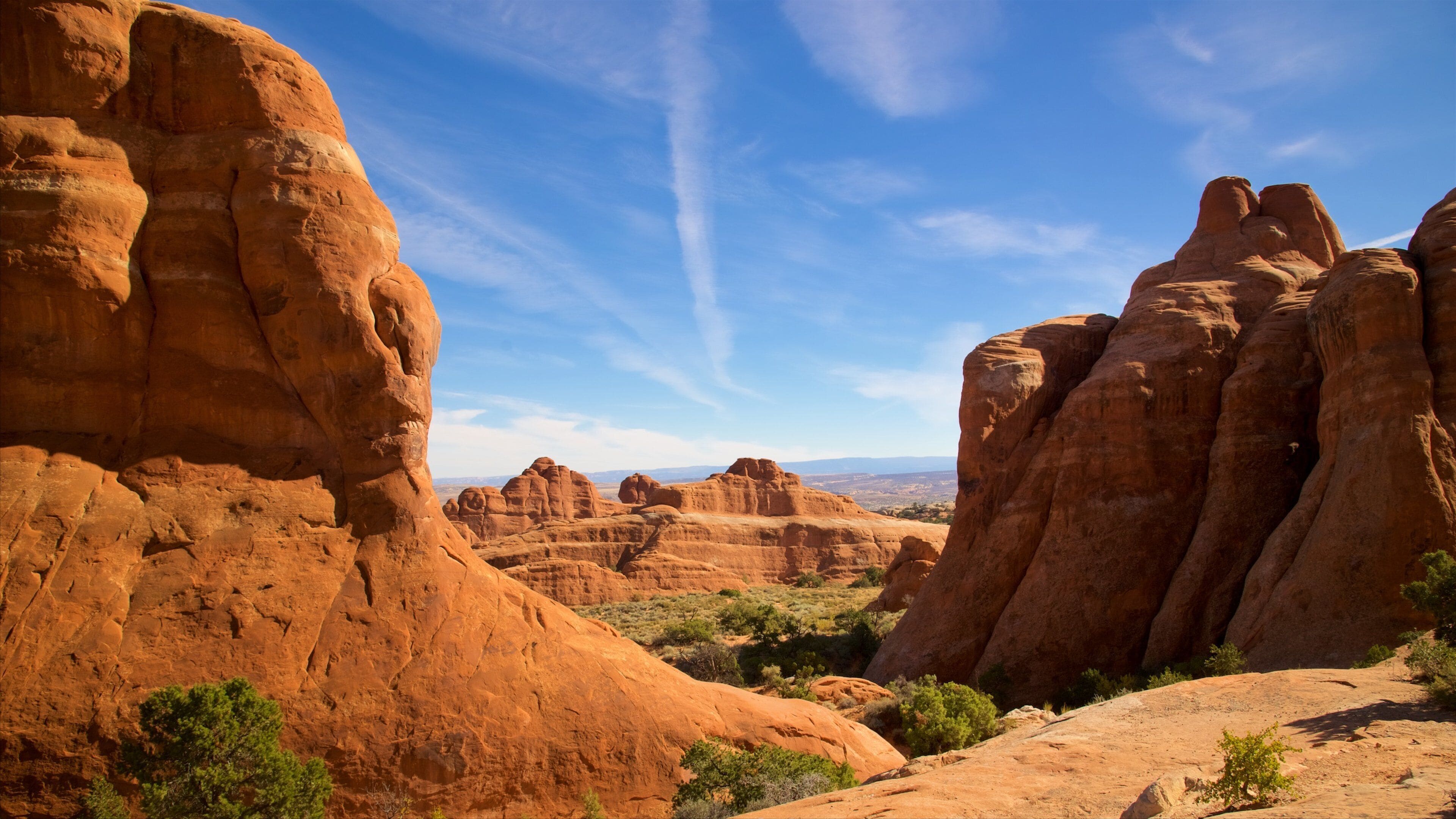 Arches National Park featuring tranquil scenes, desert views and a gorge or canyon