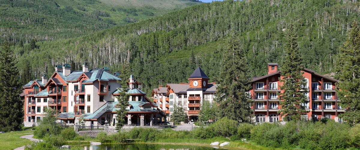 Solitude Mountain Resort showing a pond, forests and a small town or village