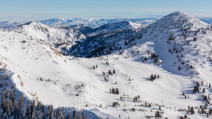 Panoramic view of mountains and skyline from Hidden Peak at Snowbird in Little Cottonwood Canyon in the Wasatch Range near Salt Lake City, Utah, USA.