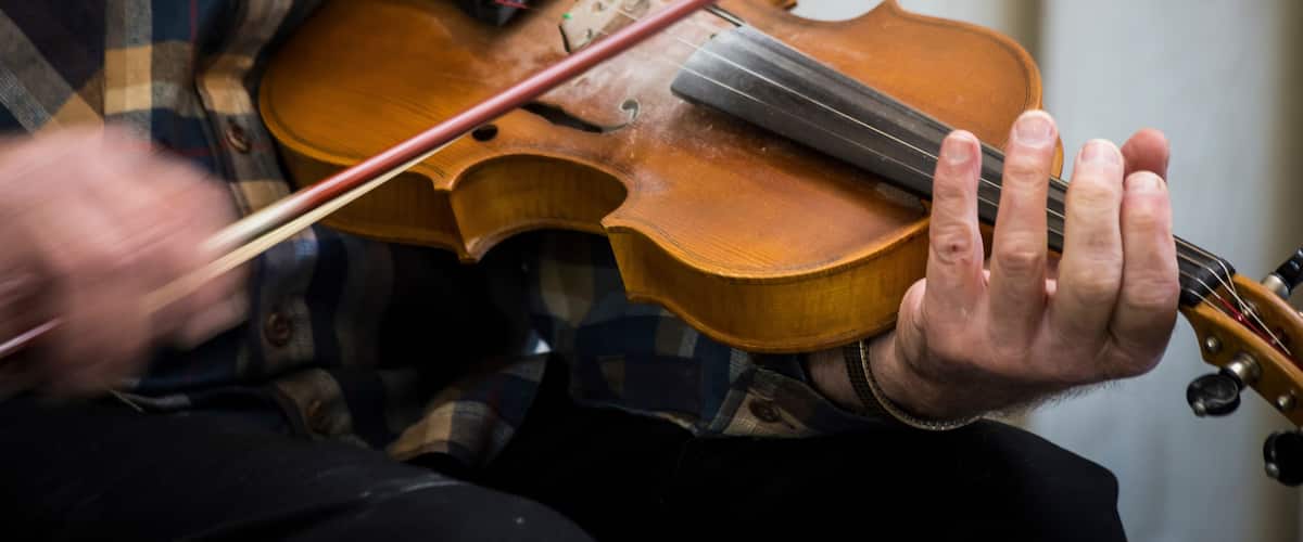 USA, Virginia, Blue Ridge Parkway. Man fiddling at the Blue Ridge Music Center.