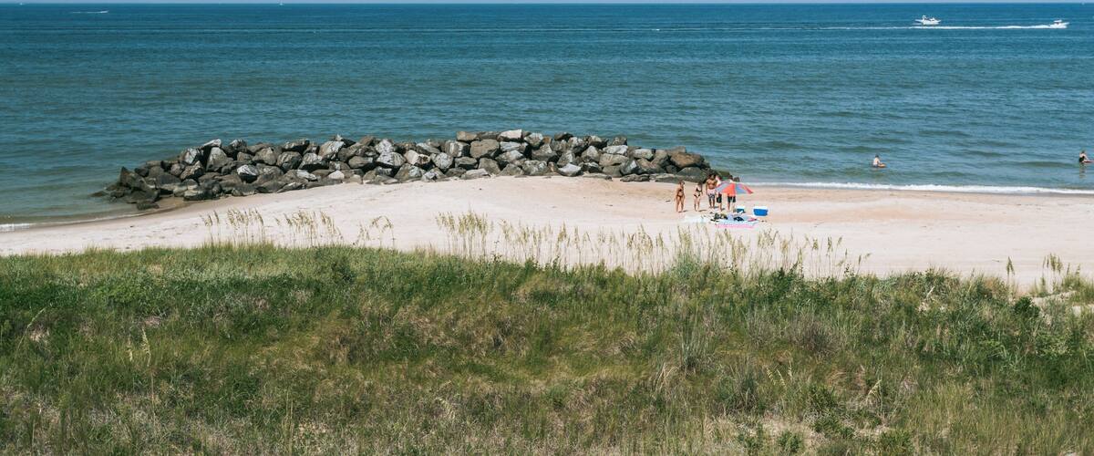 Cape Henry Memorial showing a sandy beach and general coastal views