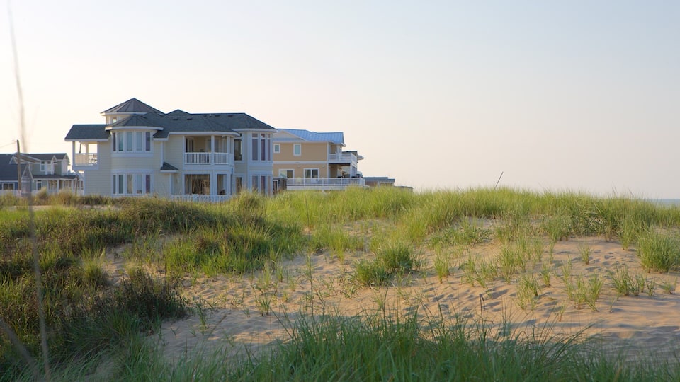 Sandbridge Beach which includes a house, a sandy beach and general coastal views