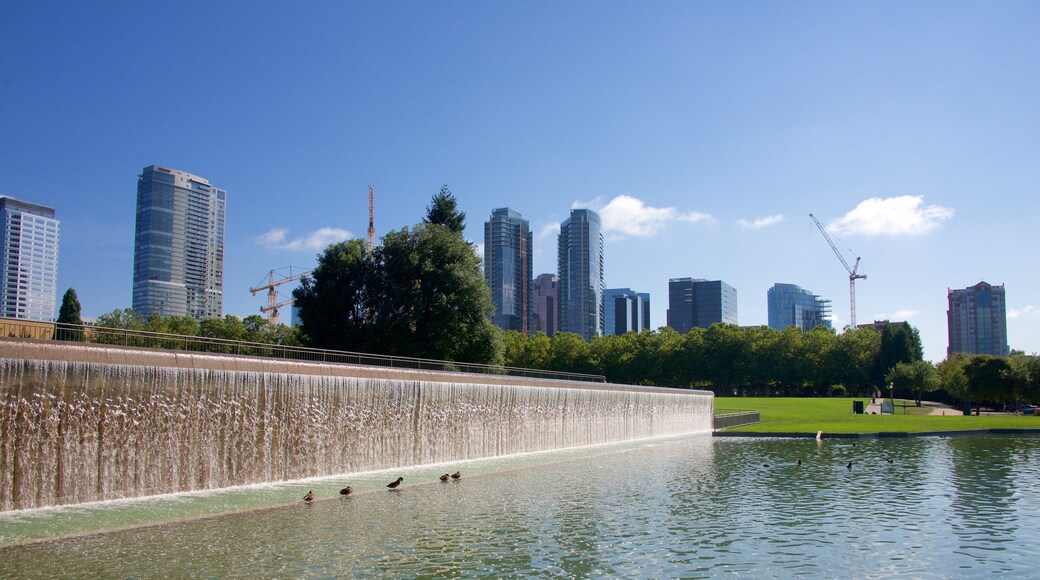 Downtown Park which includes a park and a pond