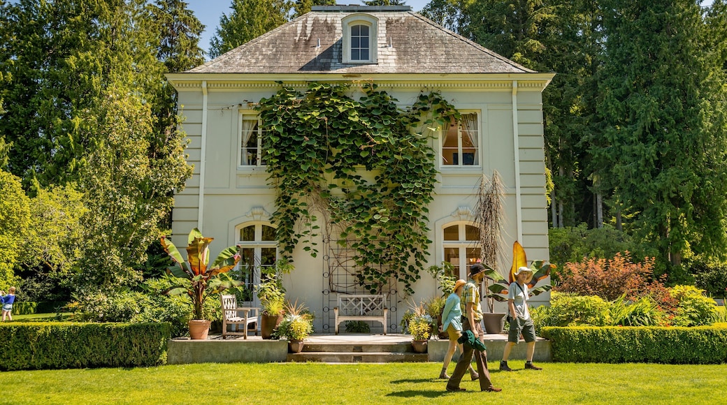 Bloedel Reserve featuring a garden and a house as well as a small group of people