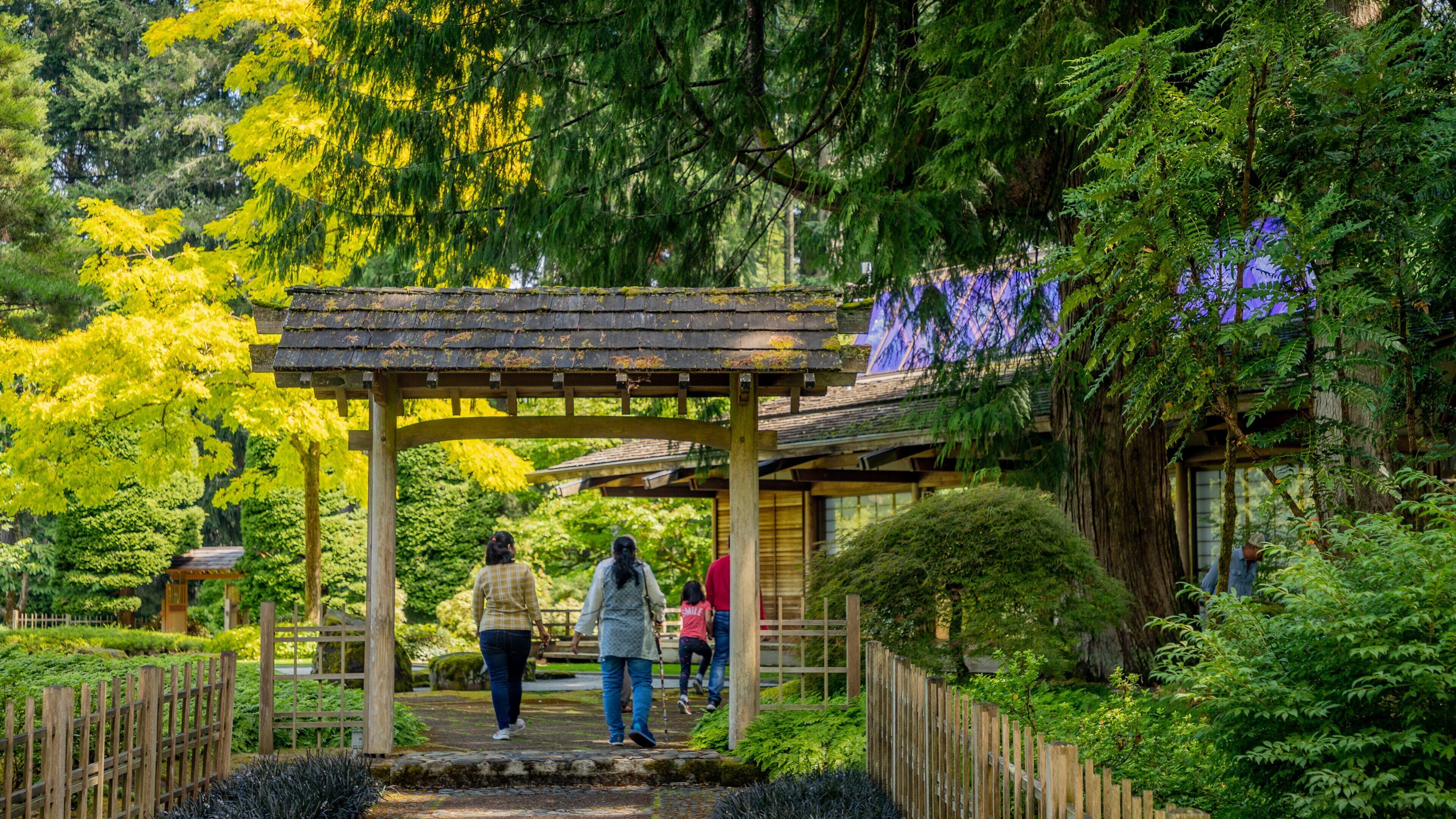 Bloedel Reserve showing a garden as well as a small group of people