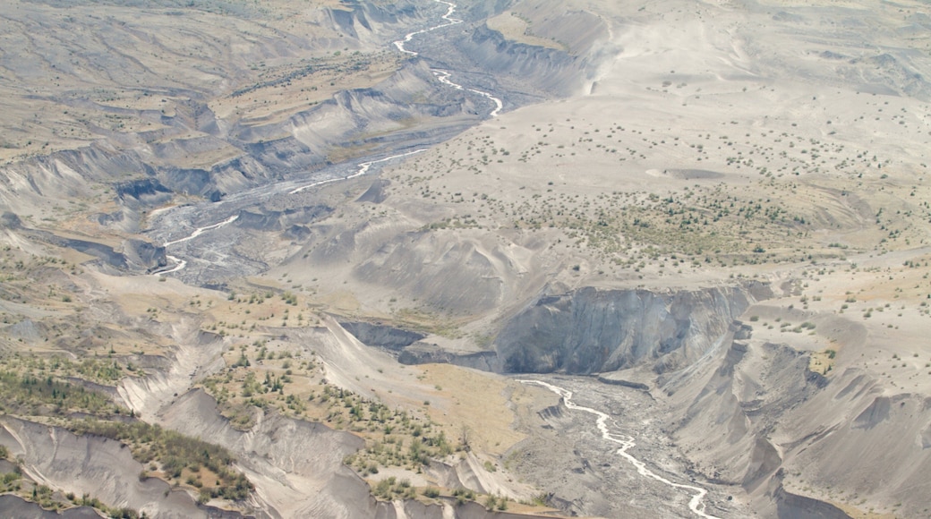 Mount St. Helens and its flowing waters under clear skies near Castle Rock, Washington
