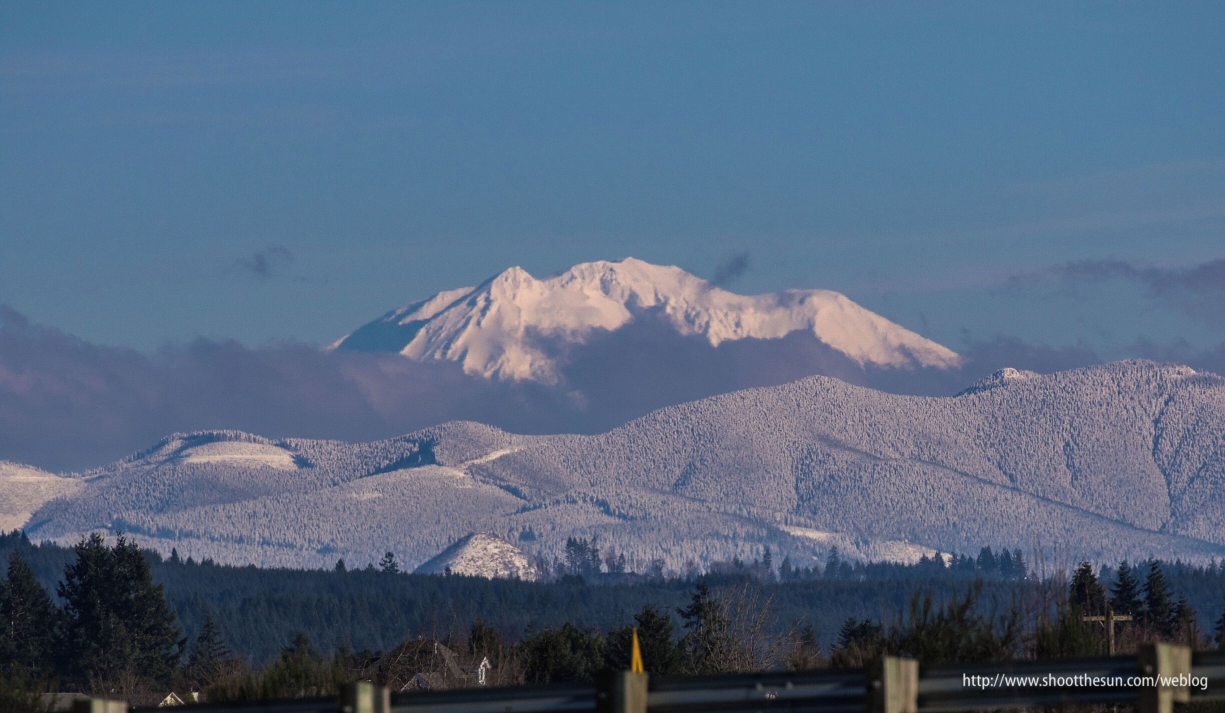 From Ridgefield, it looks as if you're sitting right on top of it.  But it's still a good fifty miles away.
