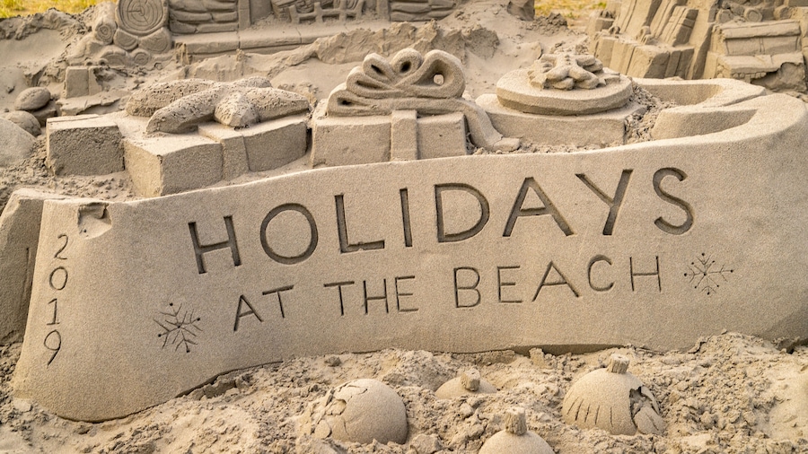 Long Beach featuring outdoor art, signage and a sandy beach