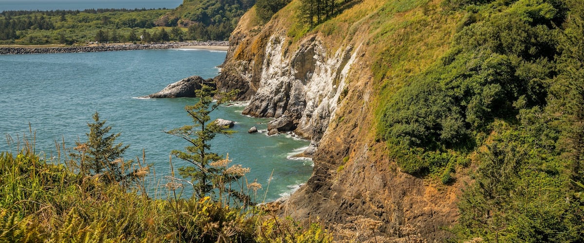 Lewis and Clark Interpretive Center which includes rocky coastline and general coastal views