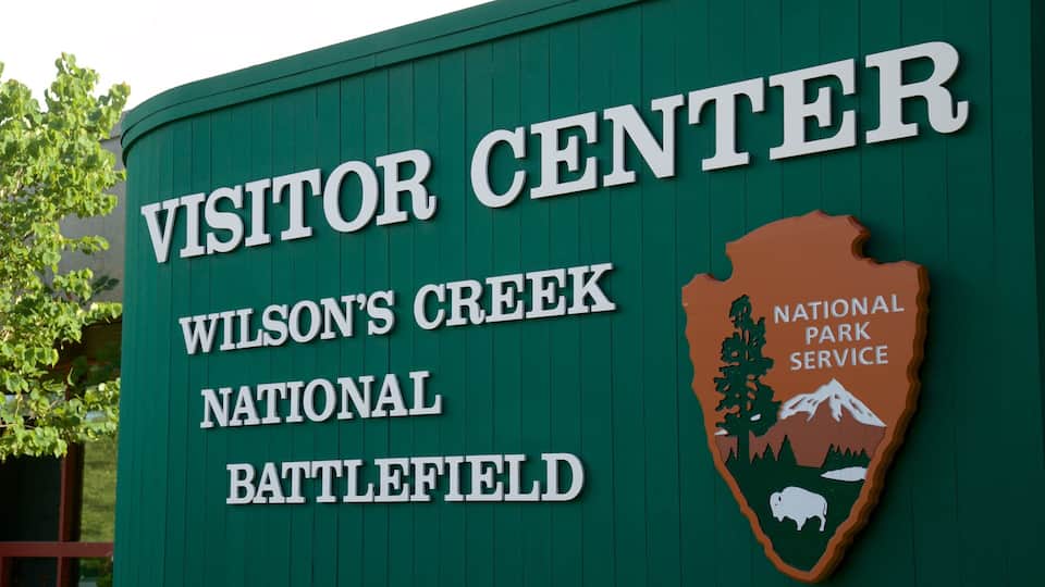 A sign for the Visitor Center at Wilson's Creek National Battlefield.