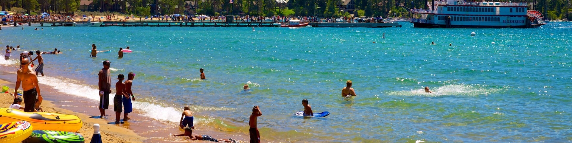 Zephyr Cove Beach which includes a coastal town, swimming and general coastal views