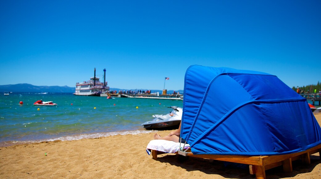 Zephyr Cove Beach showing boating, a beach and jet skiing