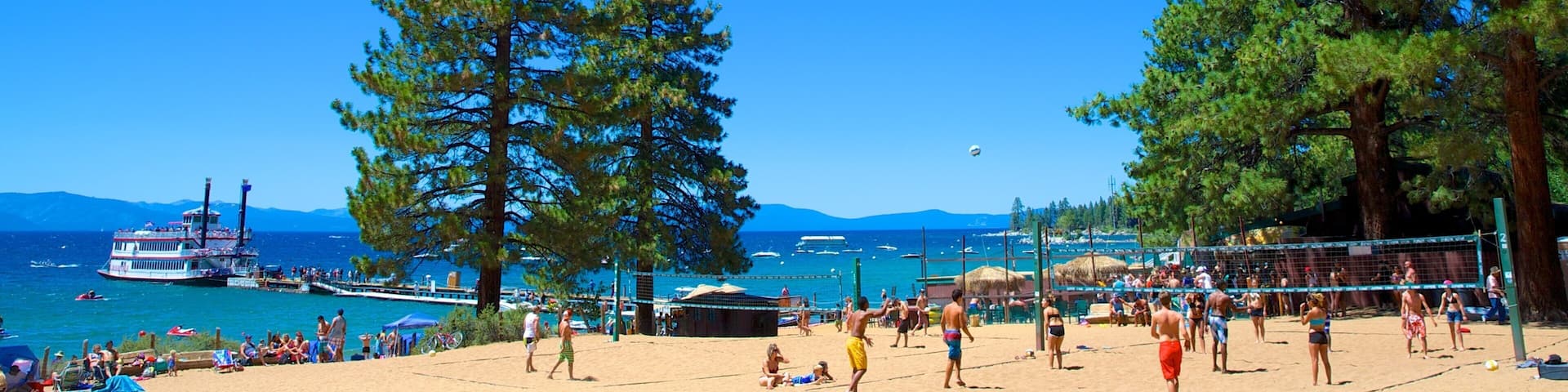 Zephyr Cove Beach showing a beach as well as a small group of people