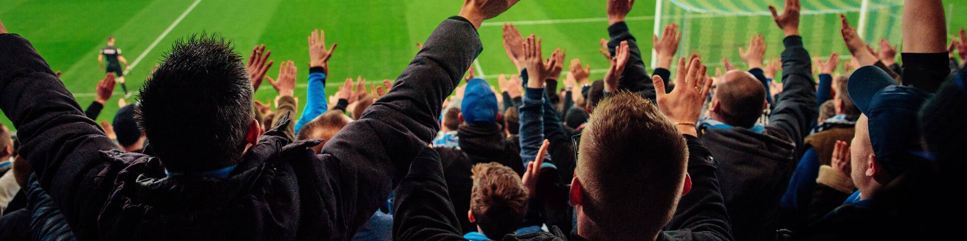 Photo – crowded soccer stadium, football fans support the team