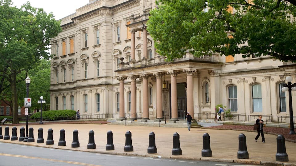 A historic building with classical architecture, including columns and ornate details.