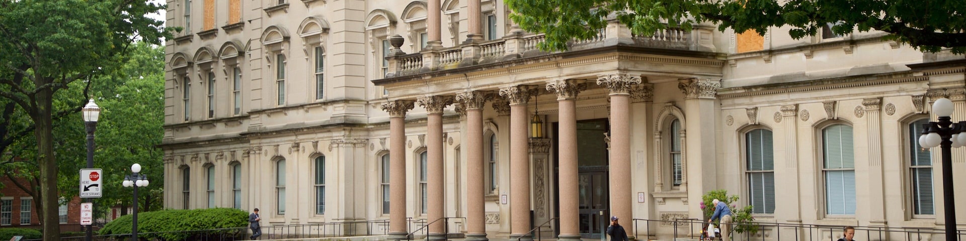 A historic building with classical architecture, including columns and ornate details.