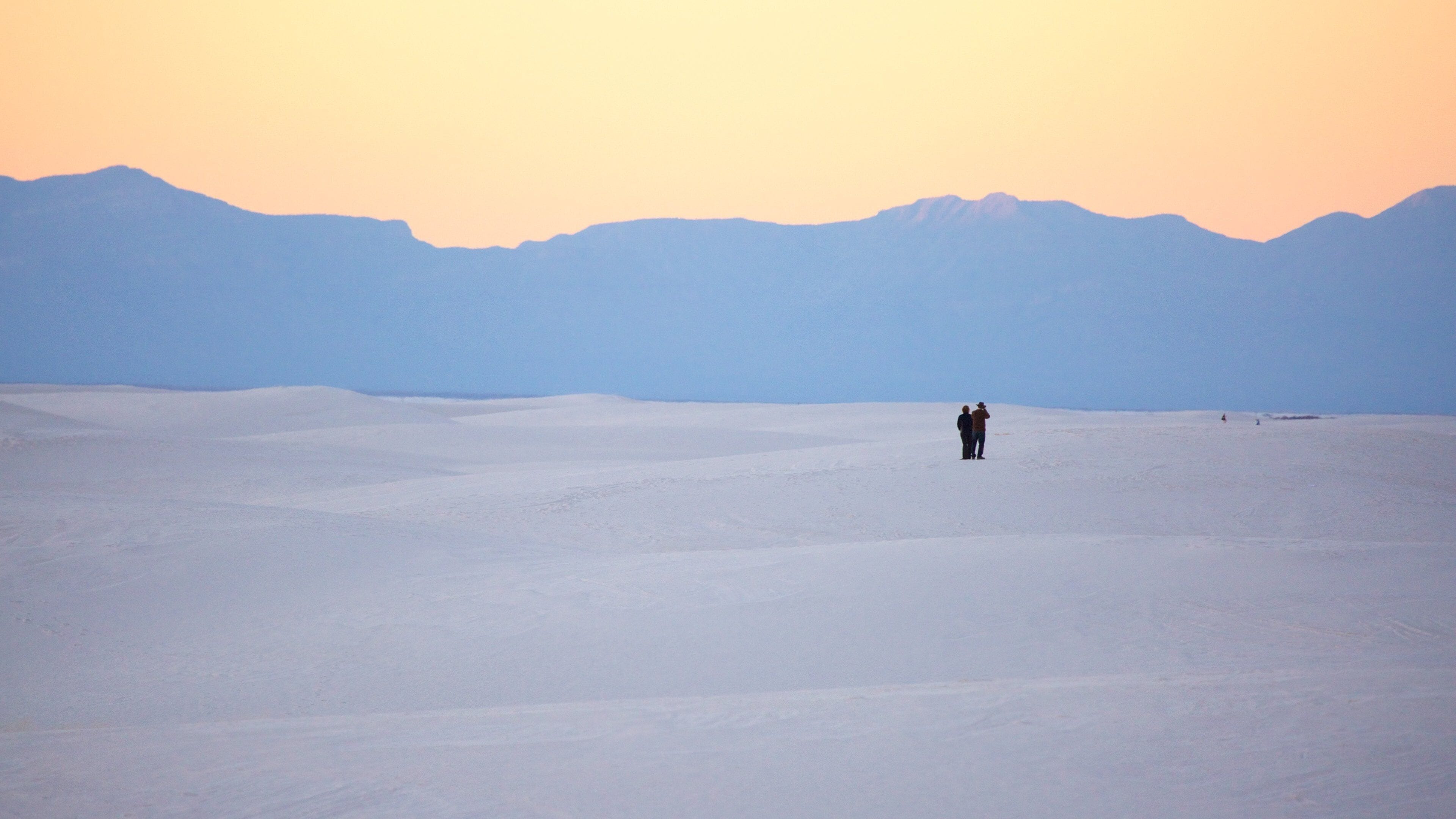 White Sands National Monument featuring a sunset, desert views and mountains