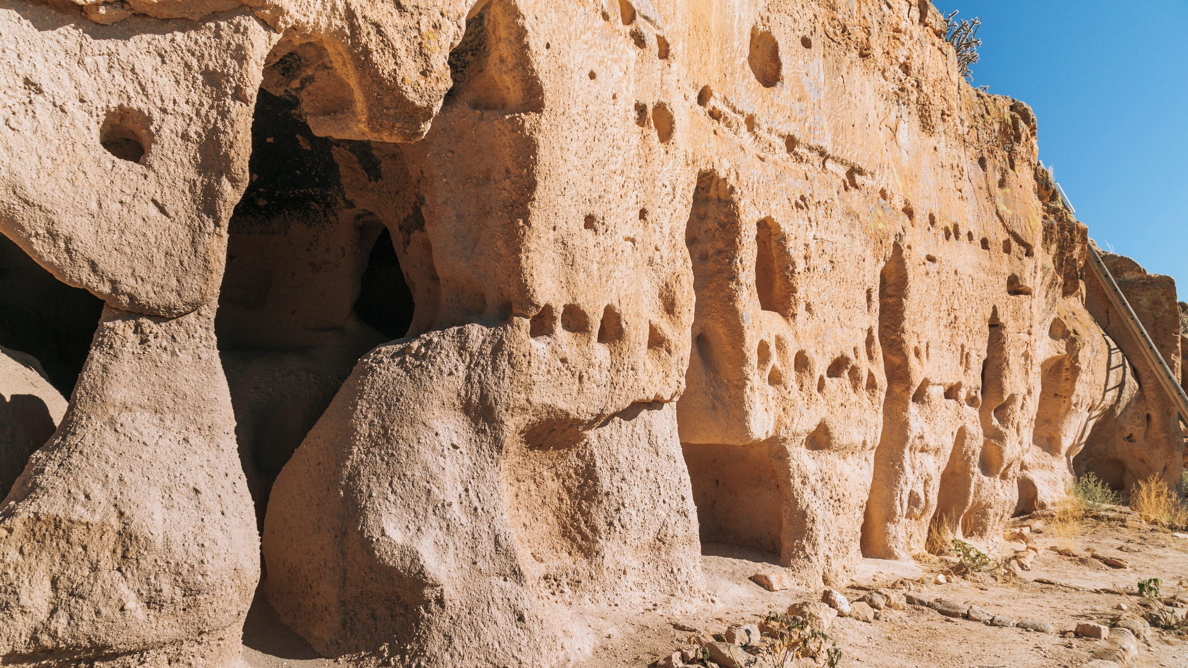 Exploring the ancient Puye Cliff Dwellings in Santa Fe, New Mexico, revealing the architectural heritage of Native American cultures