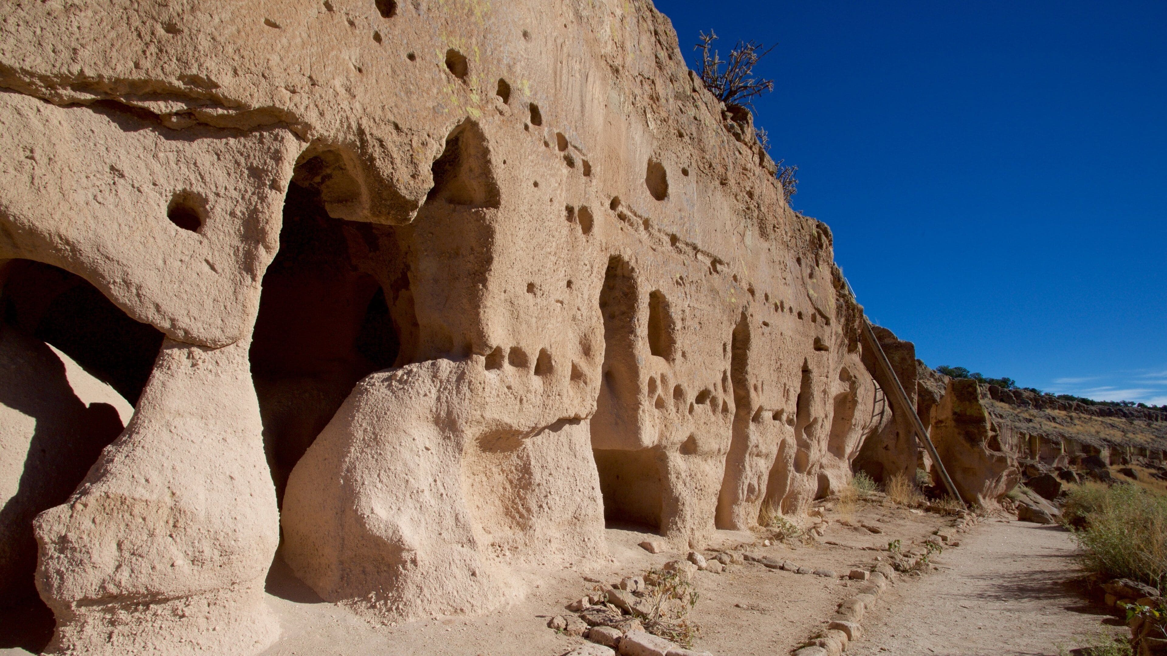 Puye Cliff Dwellings showing heritage elements and building ruins
