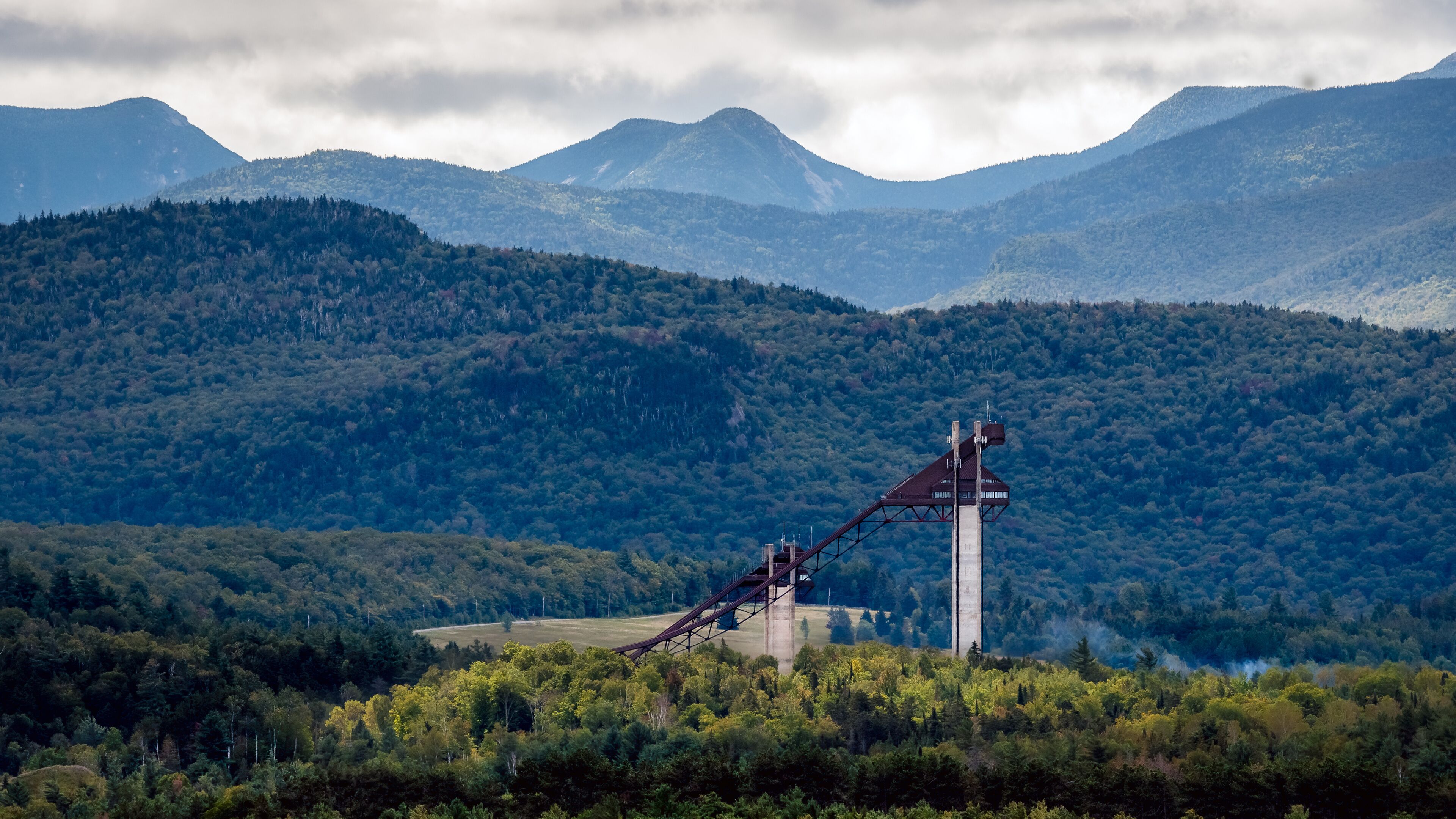 A long view of the Olympic ski jumps as part of the Lake Placid Olympic Sports Complex in the Adirondack Mountains, New York