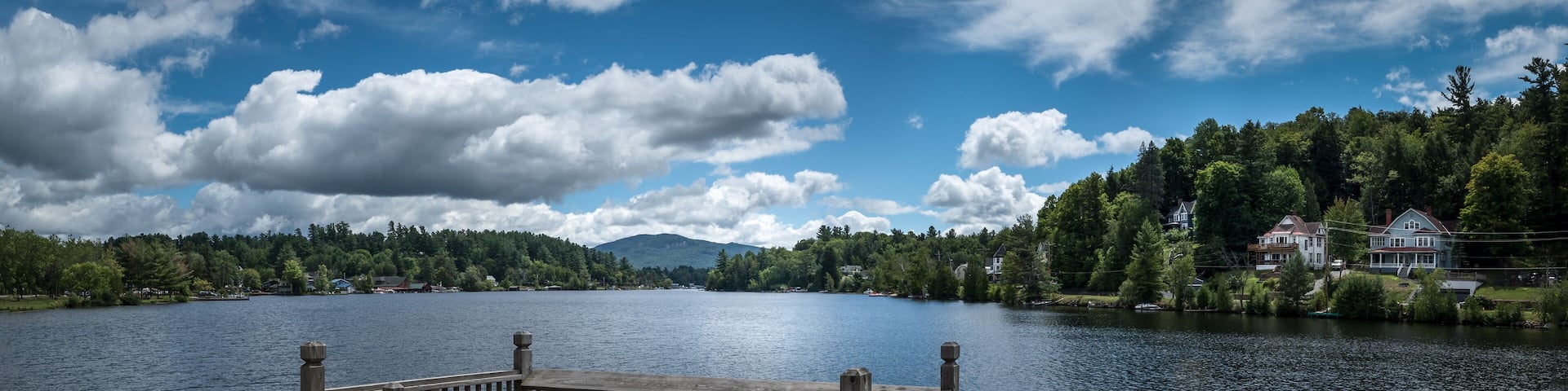 Panoramic view of Lake Flower at Saranac Lake, NY, in the Adirondacks on a sunny summer day