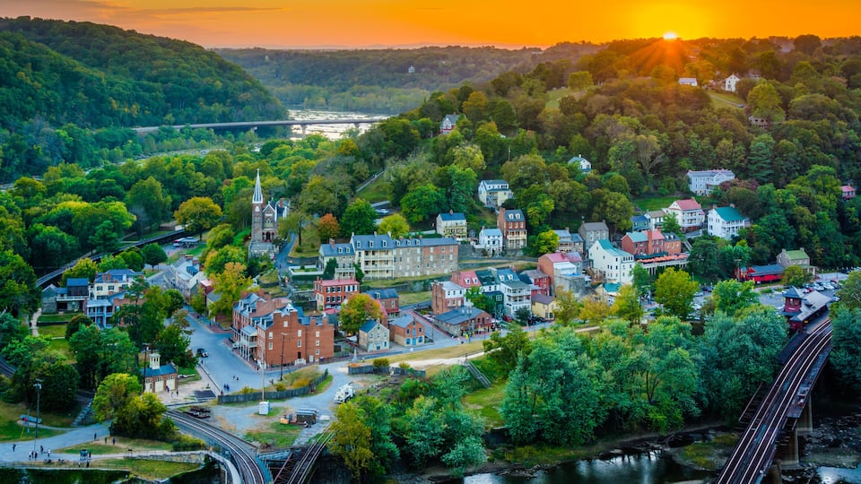 A town with a church, a river, and a bridge.
