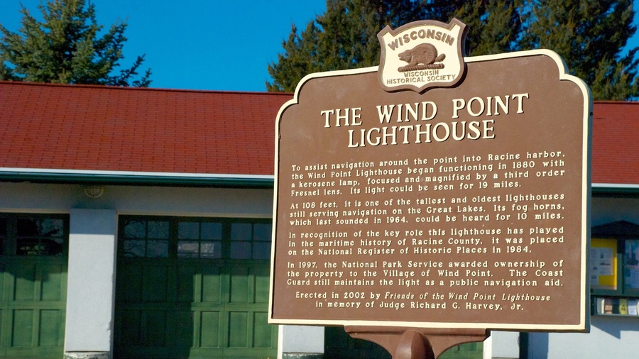 Wind Point Lighthouse featuring a lighthouse, heritage architecture and signage