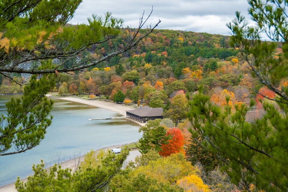 Scraggy Pine Trees Growing from Quartzite Cliffs Overlooking the Blue Water of Devil's Lake in Baraboo Wisconsin