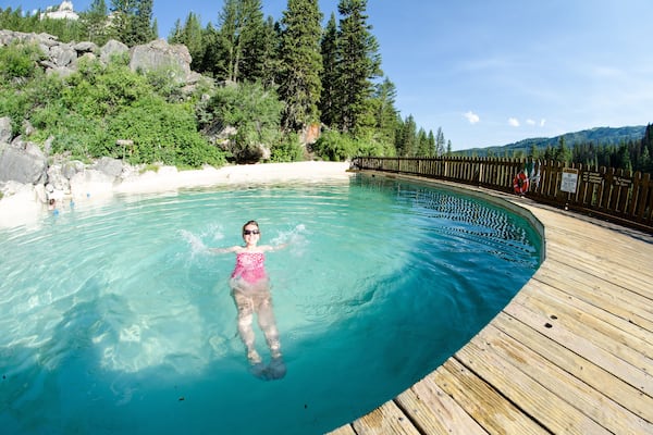 An adult female goes for a swim at Granite Creek Hot Springs, a natural hot spring in Jackson Hole, Wyoming. Fisheye view
