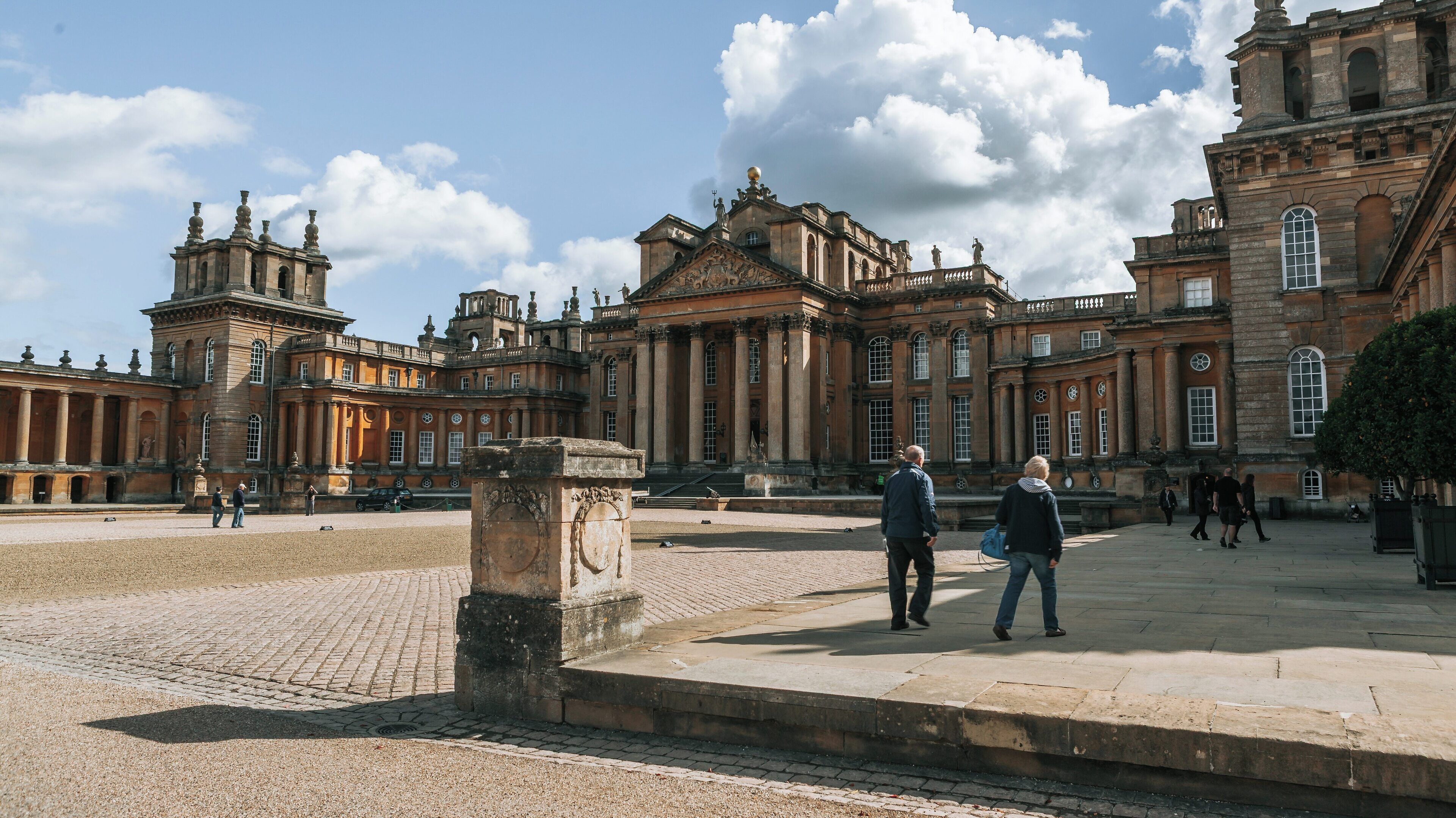 Exploring the grandeur of Blenheim Palace in Woodstock, England on a sunny day with clouds floating above