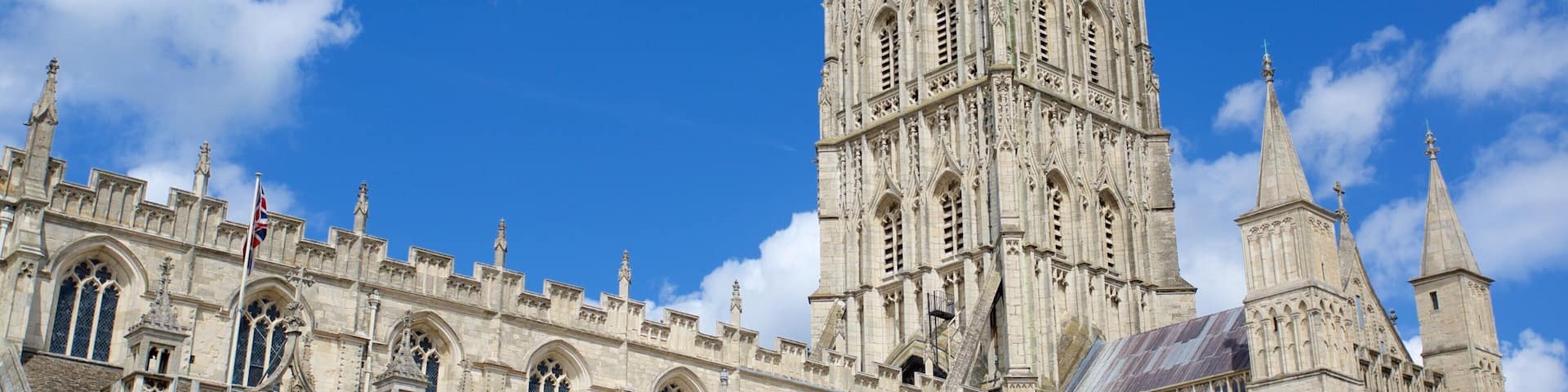 A Gothic cathedral with intricate stonework and a tall spire.