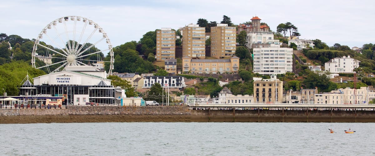 Abbey Sands which includes a coastal town, a beach and swimming