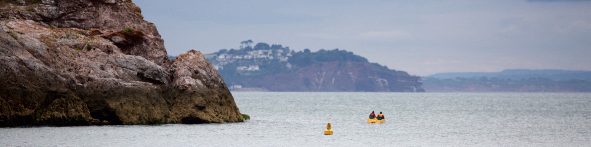 Babbacombe Beach showing kayaking or canoeing and general coastal views