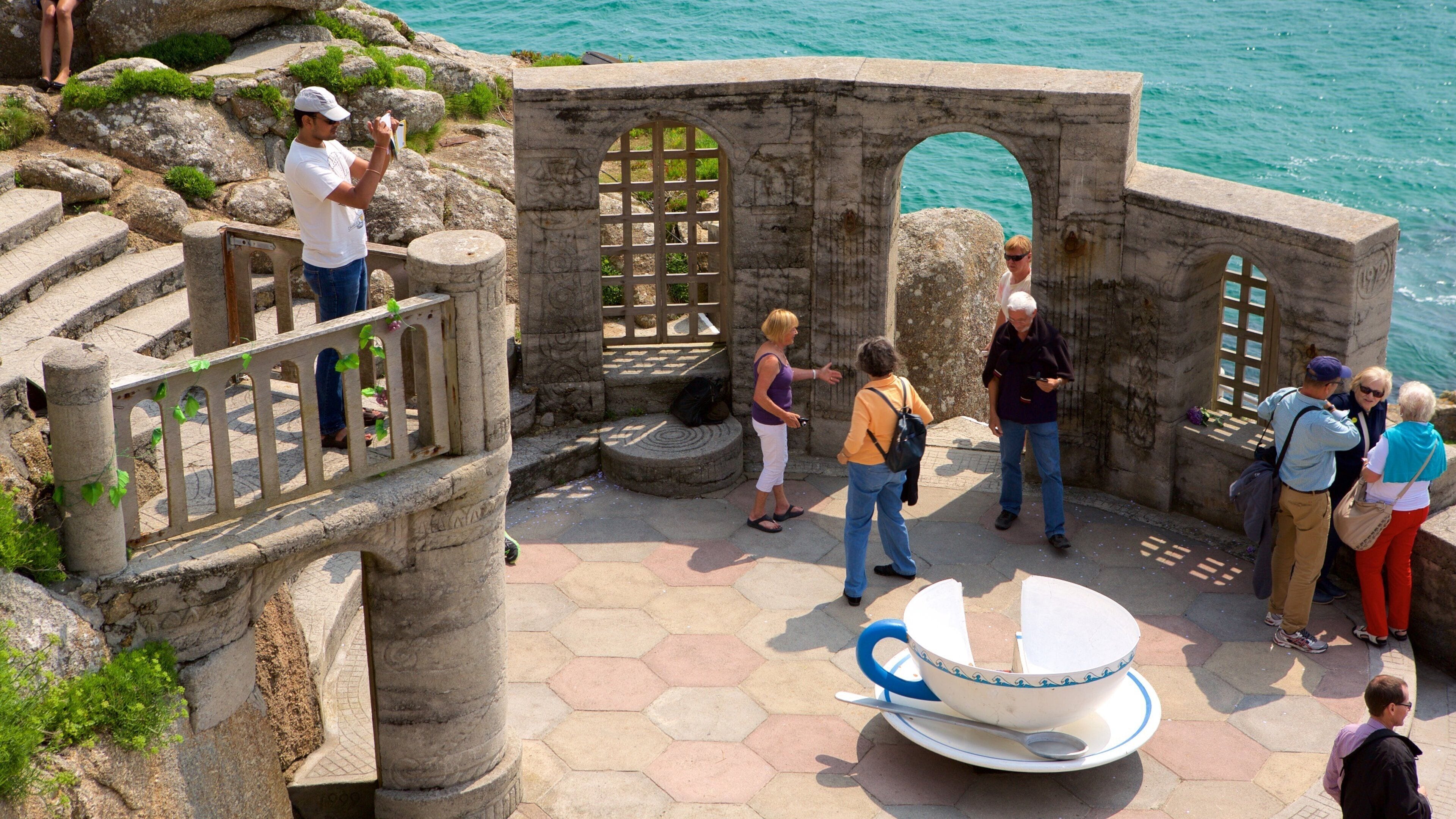 Minack Theatre which includes heritage elements and theatre scenes as well as a small group of people