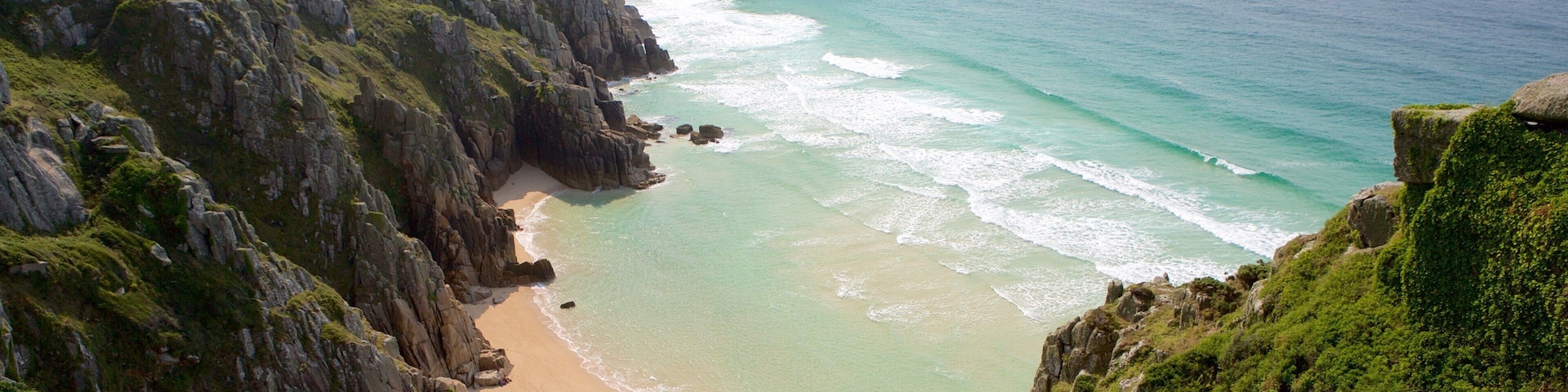 Logan\'s Rock featuring a beach and landscape views