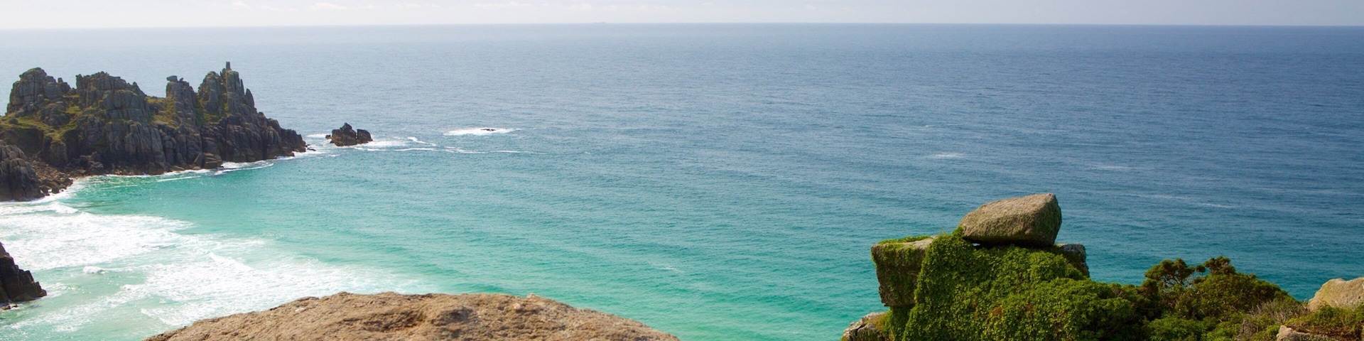 Logan\'s Rock which includes a sandy beach and landscape views