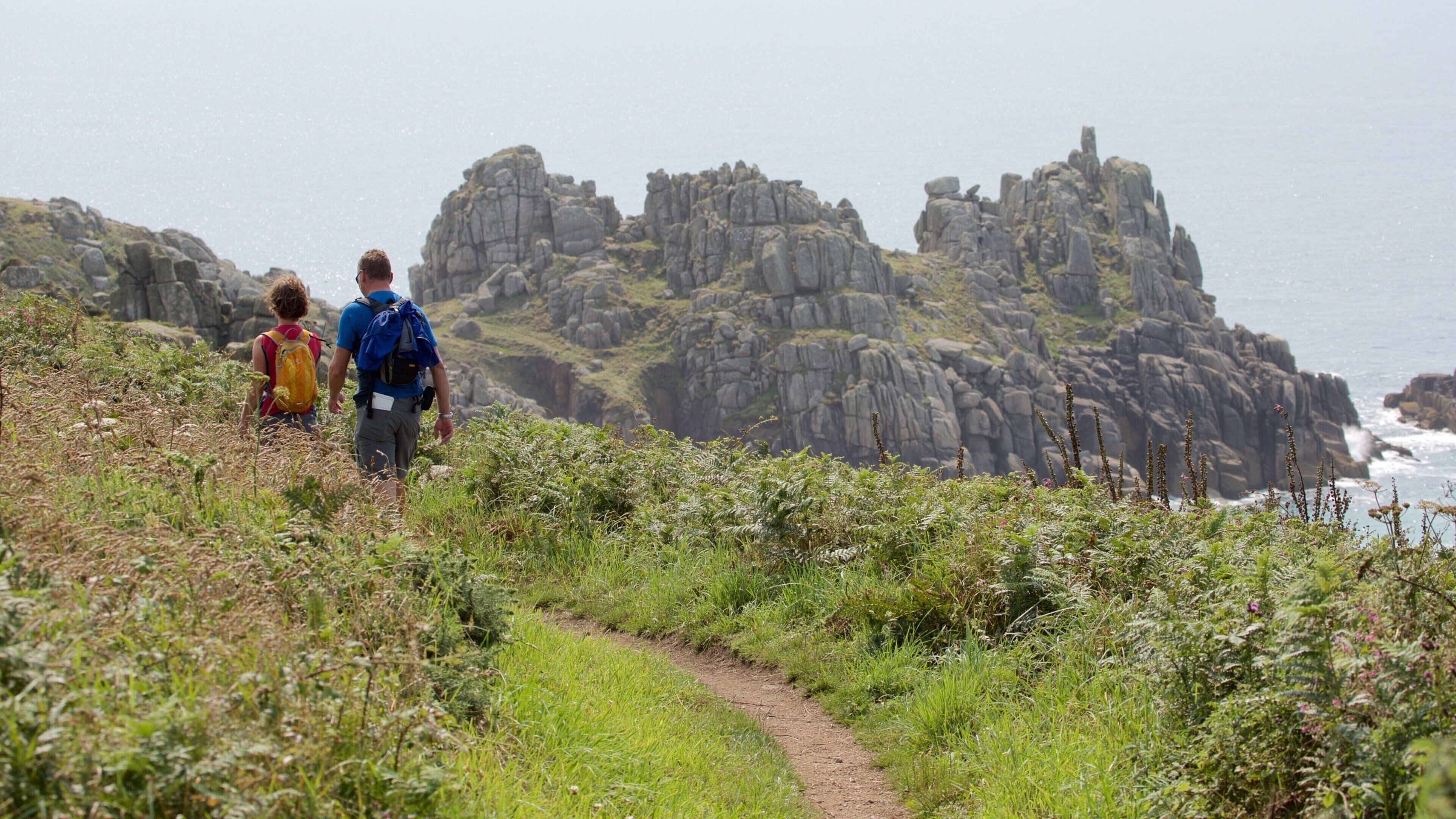 Logan\'s Rock which includes general coastal views, hiking or walking and mountains