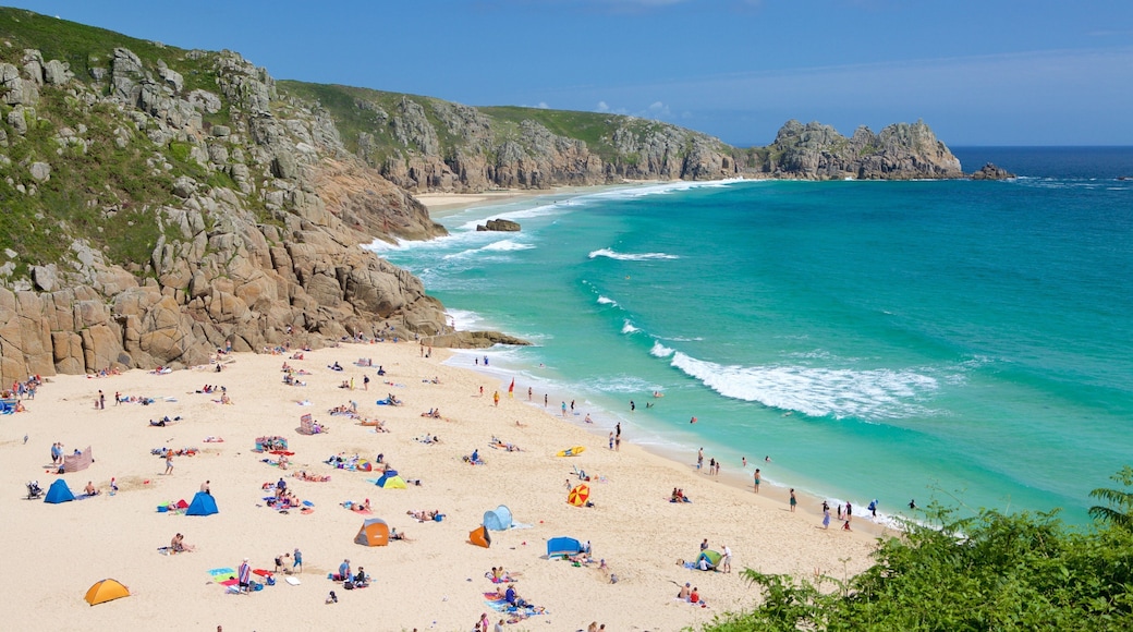 Porthcurno Beach featuring a sandy beach, swimming and landscape views