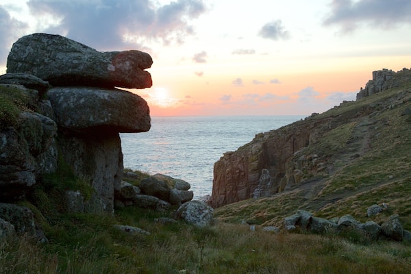 Land\'s End which includes a sunset and rocky coastline