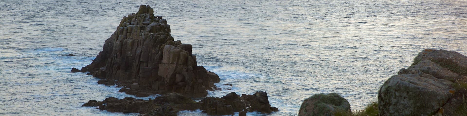 Land\'s End showing rocky coastline and a sunset
