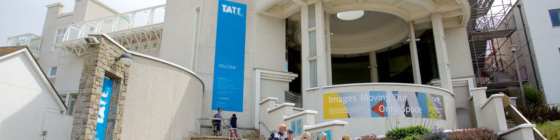 Tate St. Ives which includes heritage architecture as well as a small group of people