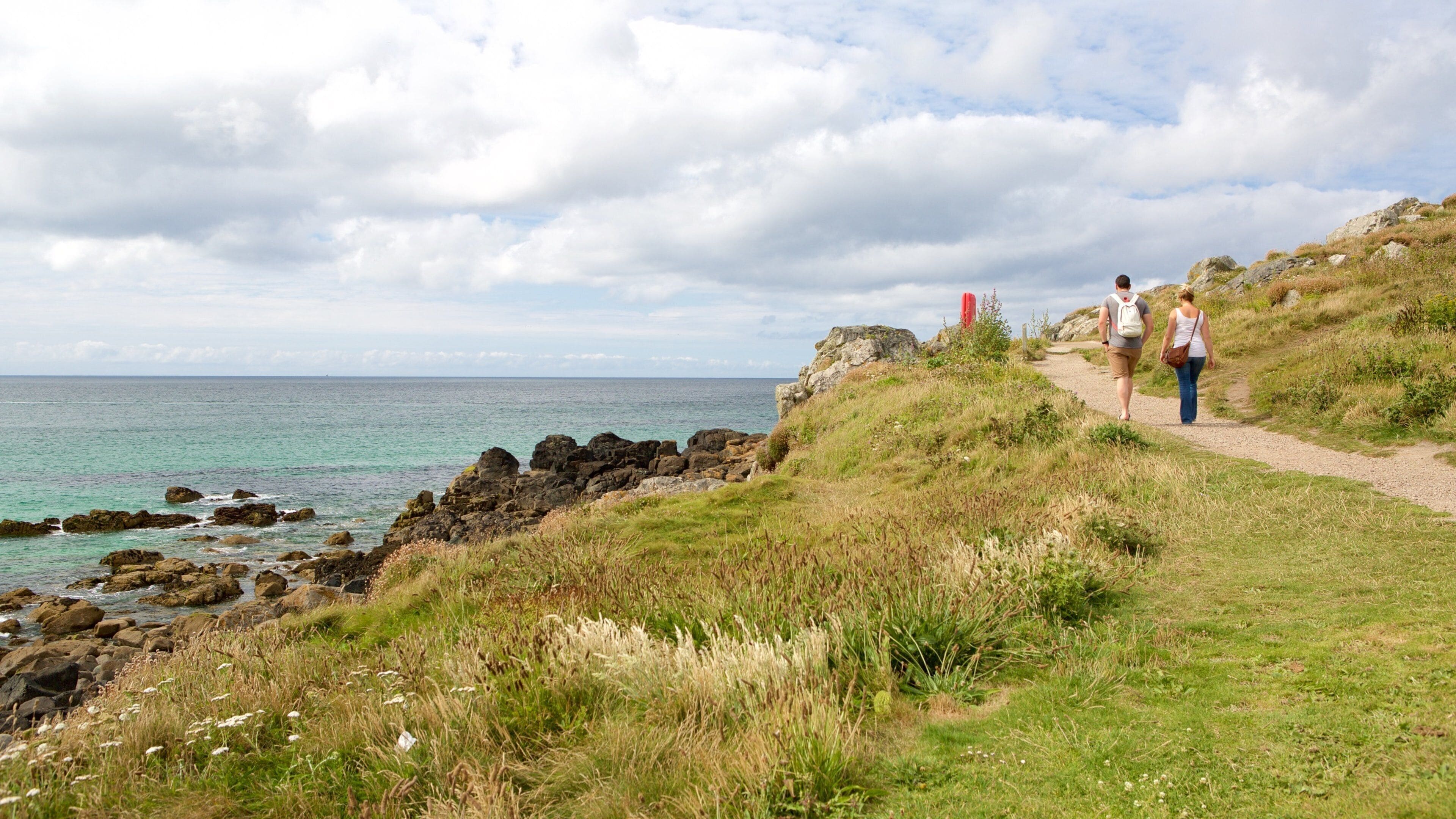 Porthmeor Beach featuring rocky coastline
