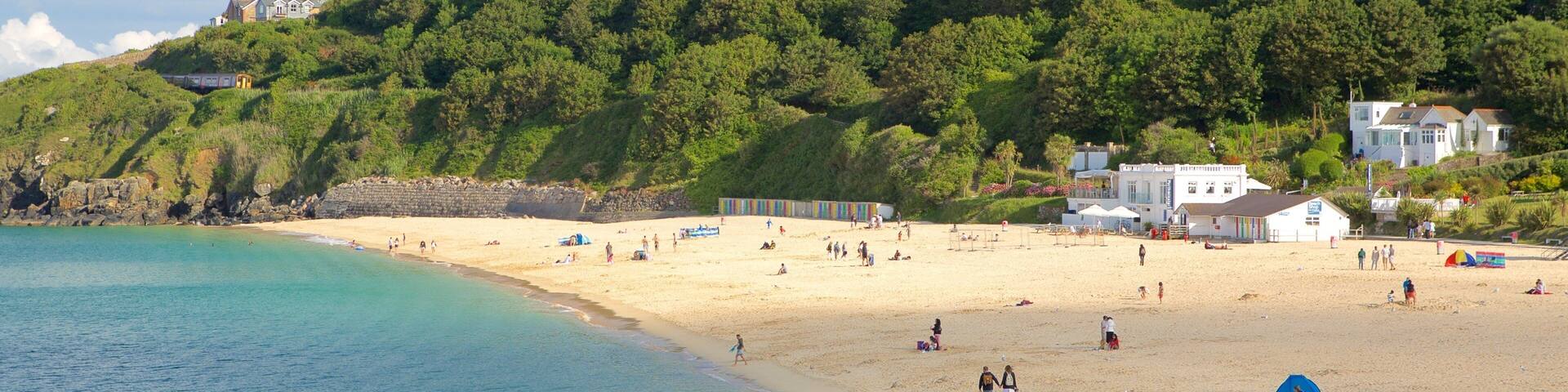 Porthminster Beach featuring a coastal town and a sandy beach